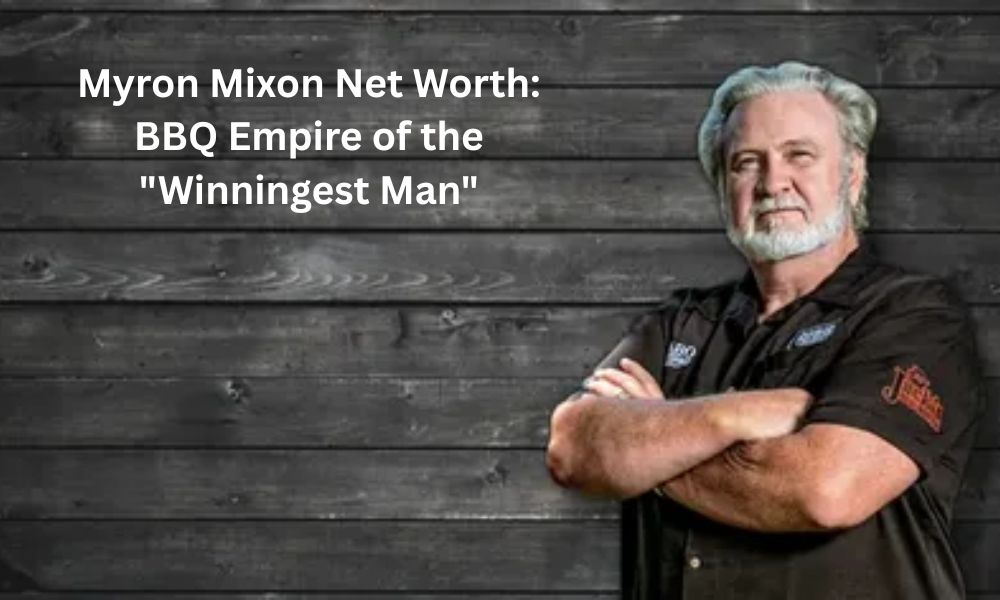 Myron Mixon, champion pitmaster in a white cowboy hat, smiling proudly next to a trophy and a smoker full of barbecue.