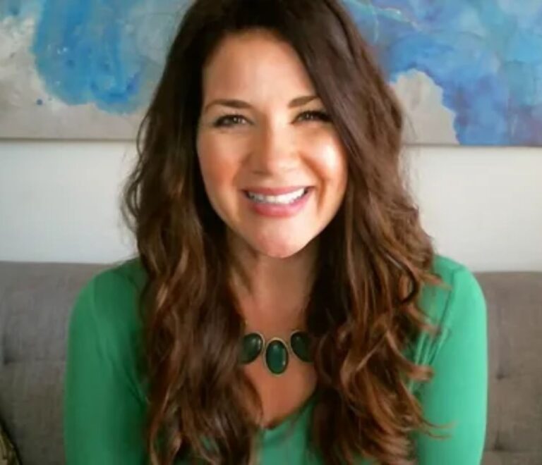 Tara Leigh Cobble, creator of The Bible Recap, smiling in a professional headshot as a Christian author and podcast host.